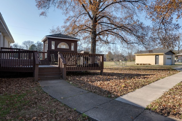 exterior space with an outbuilding and a deck