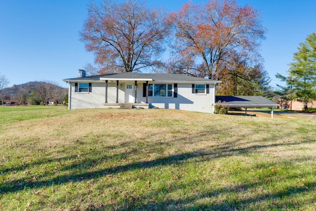 view of front of property with a mountain view and a front lawn