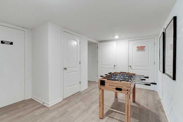 playroom with light hardwood / wood-style floors