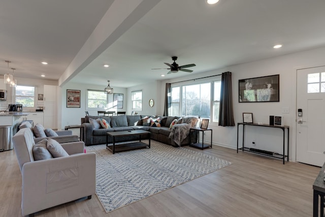 living room featuring plenty of natural light and light hardwood / wood-style floors