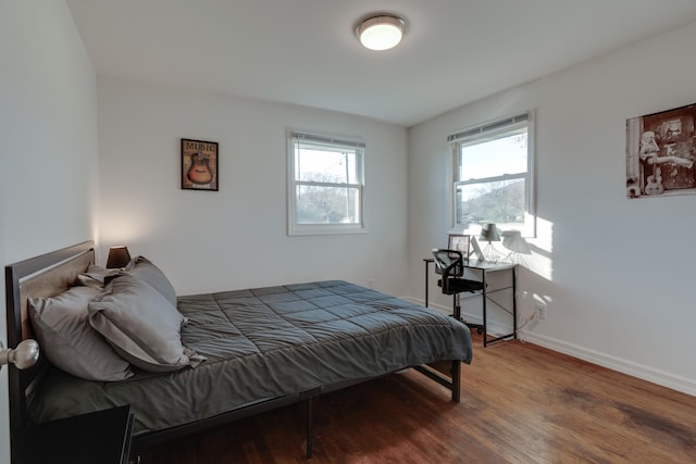 bedroom with wood-type flooring