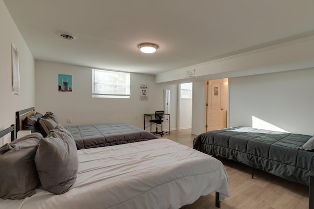 bedroom featuring light wood-type flooring