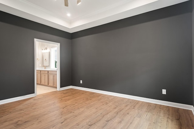 empty room featuring light hardwood / wood-style floors and ornamental molding