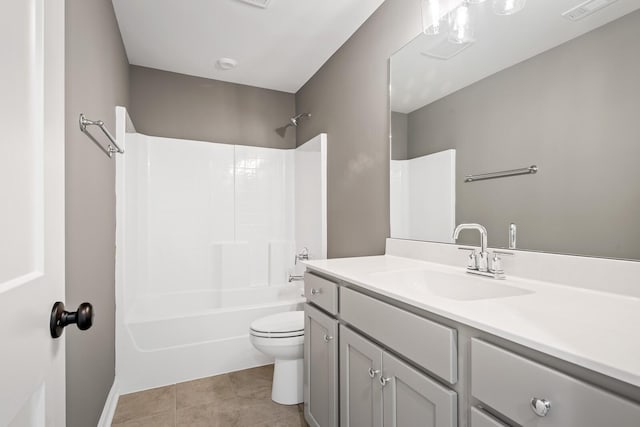 full bathroom featuring tile patterned floors, vanity, toilet, and tub / shower combination