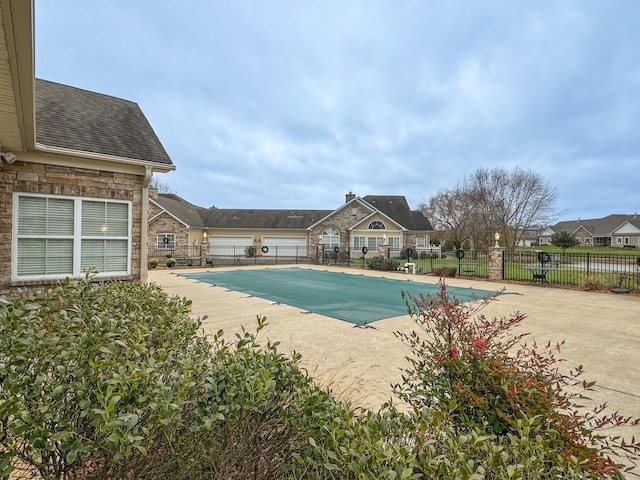 view of swimming pool with a patio