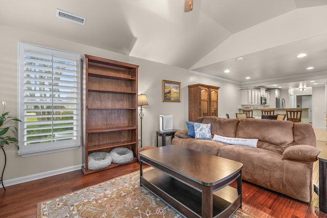 living room featuring crown molding, lofted ceiling, and dark hardwood / wood-style flooring