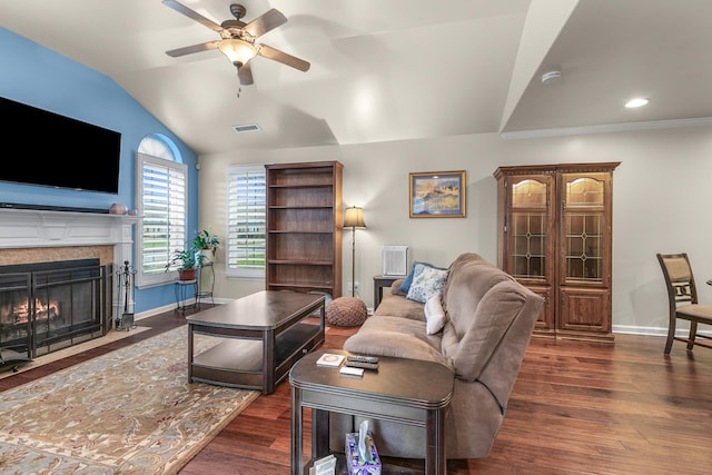 living room featuring ceiling fan, lofted ceiling, dark hardwood / wood-style flooring, and ornamental molding