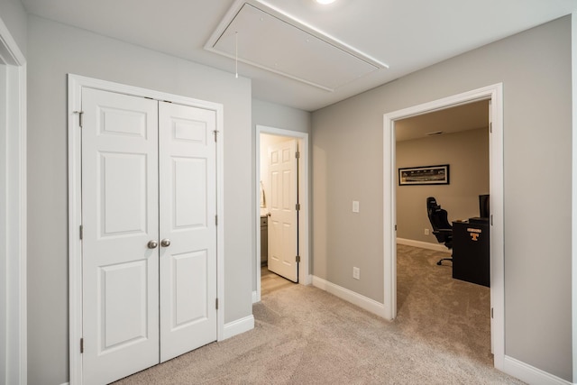 carpeted bedroom with a closet