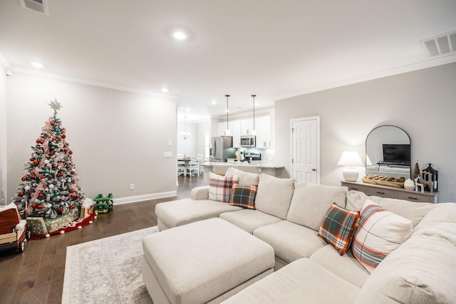 living room featuring dark hardwood / wood-style floors and ornamental molding