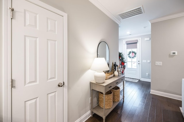 interior space featuring dark hardwood / wood-style flooring and ornamental molding