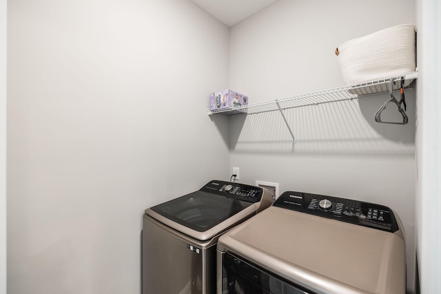 laundry area with separate washer and dryer