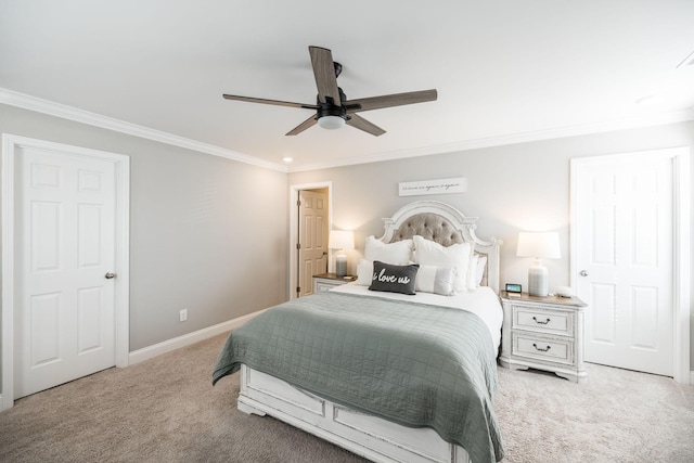 carpeted bedroom with ceiling fan and ornamental molding