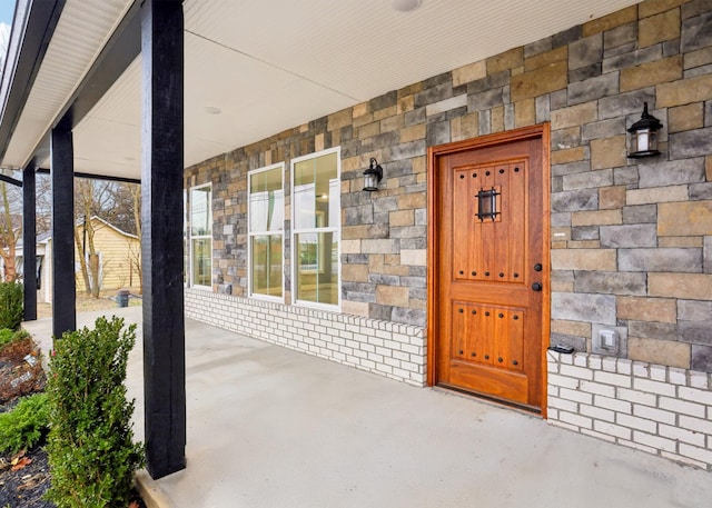 entrance to property with covered porch