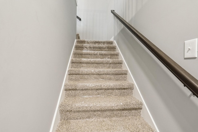 staircase with carpet