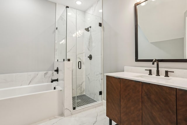 bathroom featuring vanity and separate shower and tub