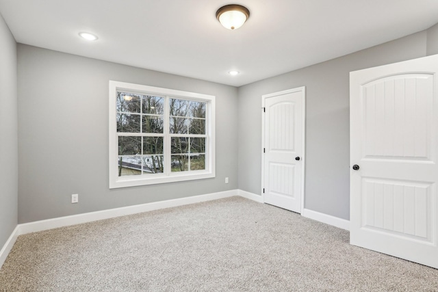 unfurnished bedroom with a closet and carpet