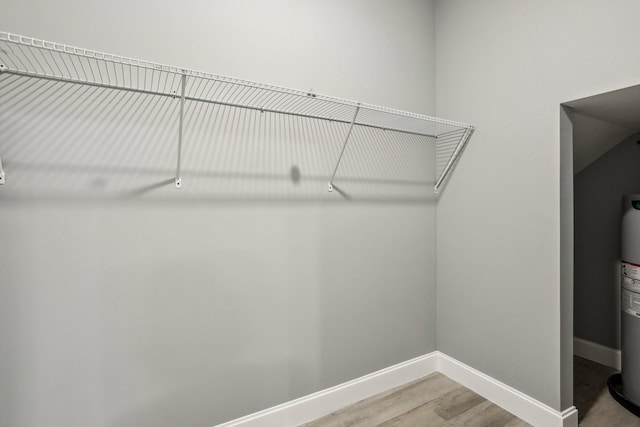 spacious closet featuring hardwood / wood-style flooring