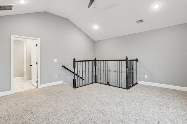 interior space with light colored carpet and lofted ceiling