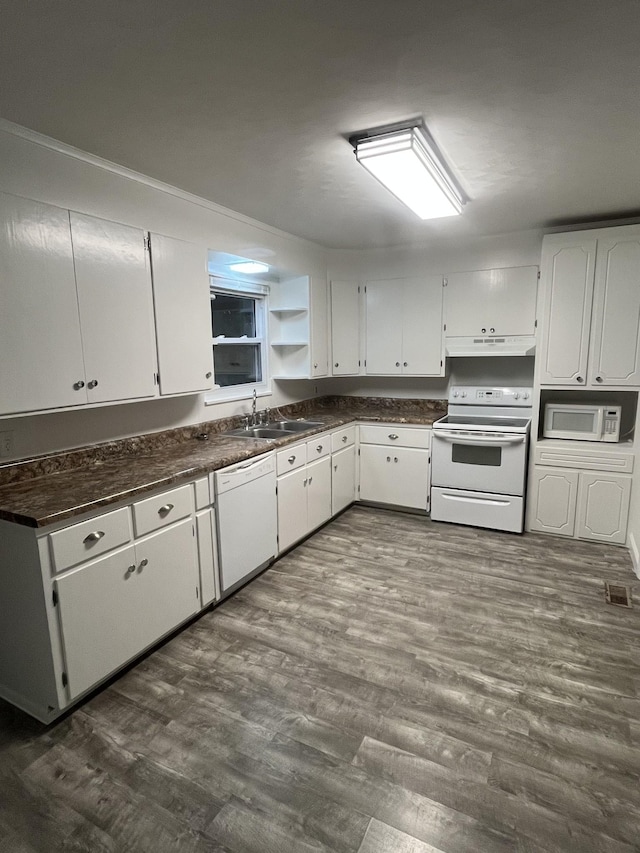 kitchen featuring sink, white cabinets, dark hardwood / wood-style floors, and white appliances