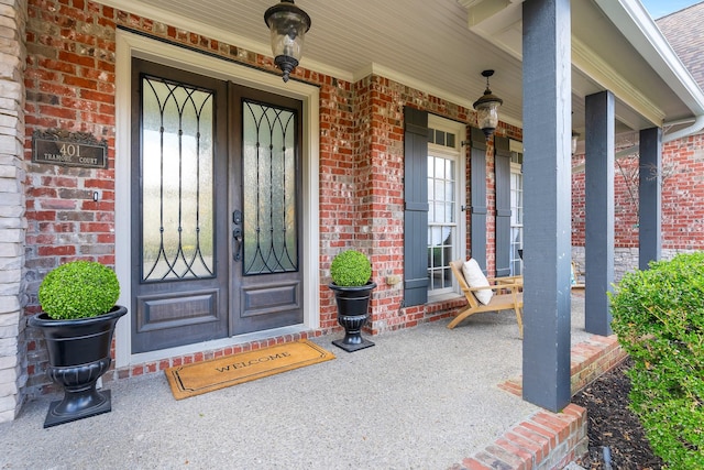 property entrance featuring covered porch