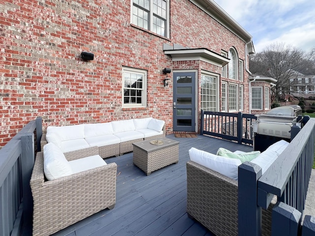 wooden terrace with an outdoor hangout area