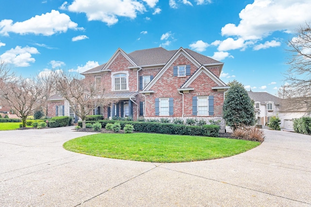 craftsman-style house with a front lawn