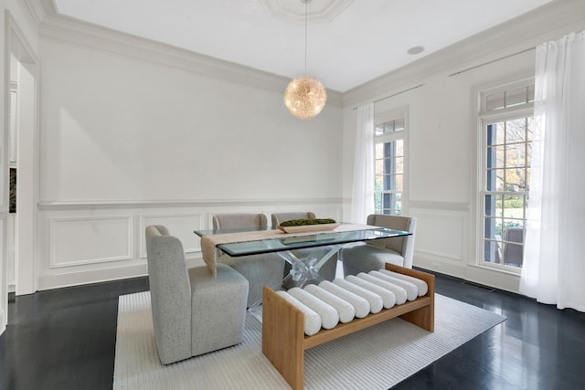 dining room featuring wood-type flooring and crown molding