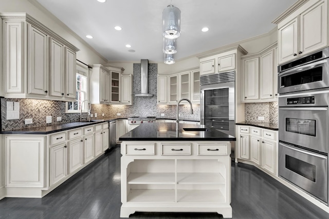 kitchen featuring backsplash, stainless steel appliances, hanging light fixtures, and wall chimney exhaust hood