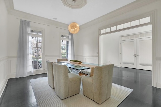 dining space featuring dark hardwood / wood-style flooring and ornamental molding