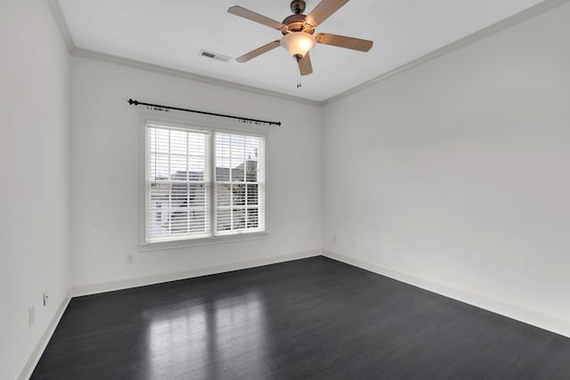 empty room featuring crown molding, ceiling fan, and dark wood-type flooring