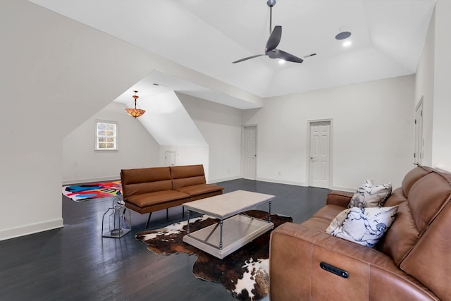 living room featuring ceiling fan, lofted ceiling, and dark wood-type flooring