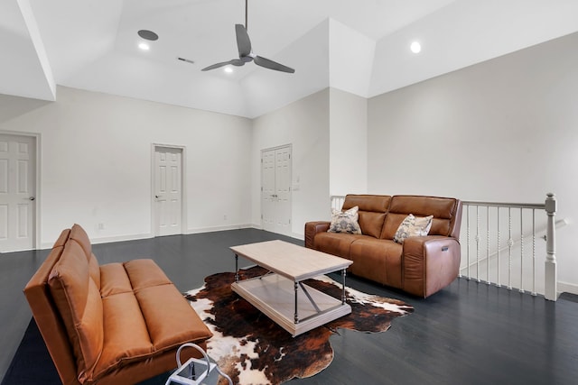 living room with dark hardwood / wood-style flooring, high vaulted ceiling, and ceiling fan