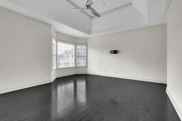 spare room with dark hardwood / wood-style floors and ceiling fan