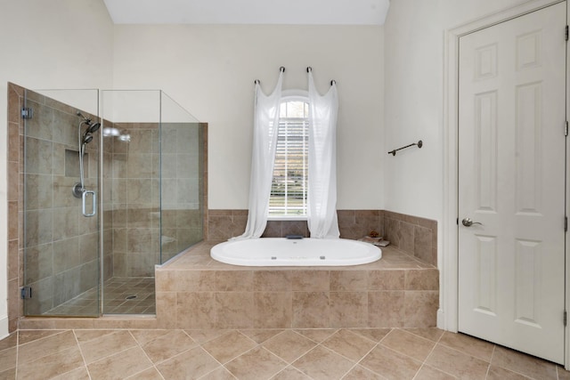 bathroom featuring tile patterned flooring and plus walk in shower