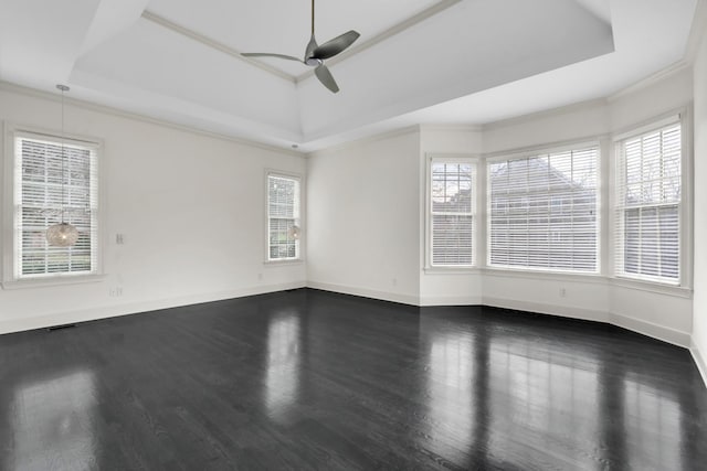 unfurnished room featuring dark hardwood / wood-style floors and a wealth of natural light