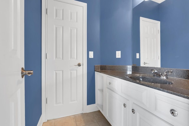 bathroom with tile patterned flooring and vanity