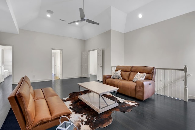 living room featuring ceiling fan, dark wood-type flooring, and high vaulted ceiling