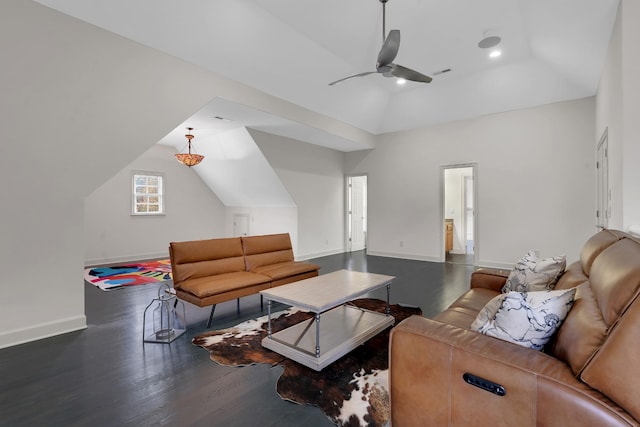 living room featuring lofted ceiling, ceiling fan, and dark hardwood / wood-style floors