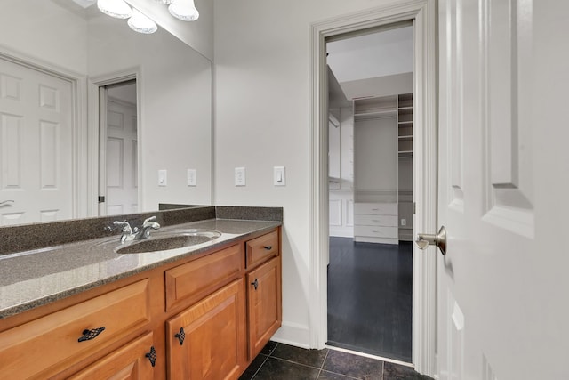 bathroom with tile patterned flooring and vanity