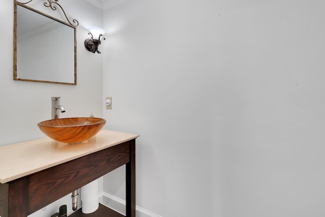 bathroom with vanity and crown molding