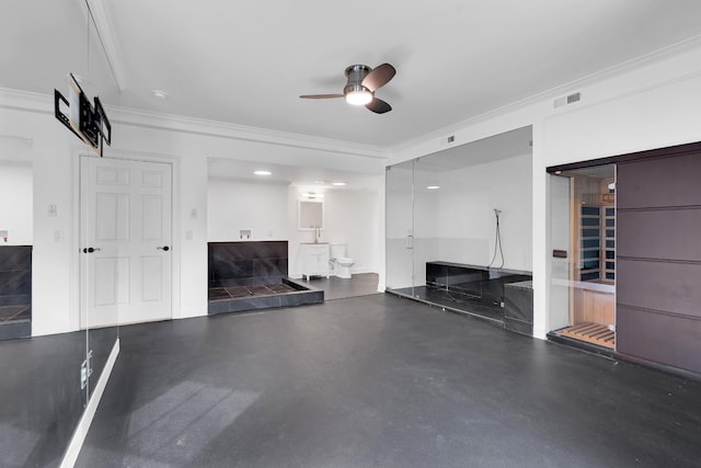 unfurnished living room with ceiling fan and ornamental molding