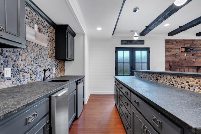 kitchen with dishwasher, french doors, sink, tasteful backsplash, and dark hardwood / wood-style floors