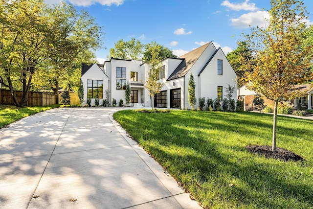 view of front facade with a front yard and a garage