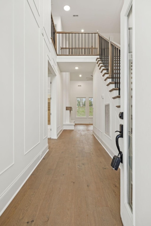 517 Matthew Miller Dr, Smyrna, TN 37167 - foyer featuring wood-type flooring, stairs, and recessed lighting