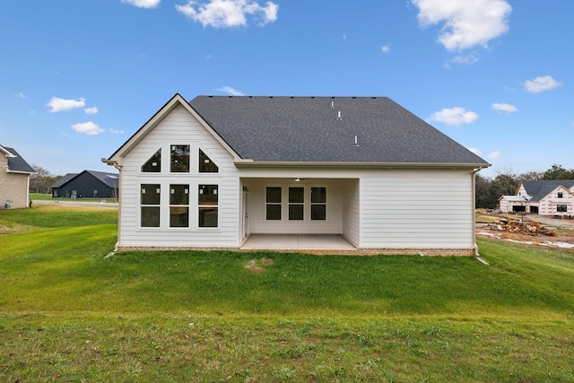 517 Matthew Miller Dr, Smyrna, TN 37167 - back of property with a patio area, a yard, and a shingled roof