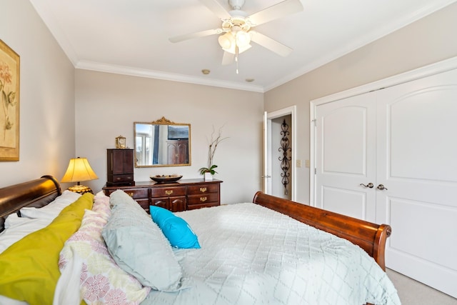 bedroom featuring ceiling fan, a closet, and ornamental molding