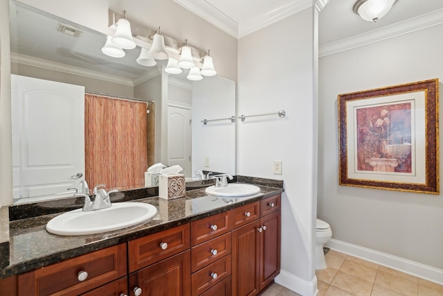 bathroom featuring tile patterned floors, crown molding, vanity, and toilet