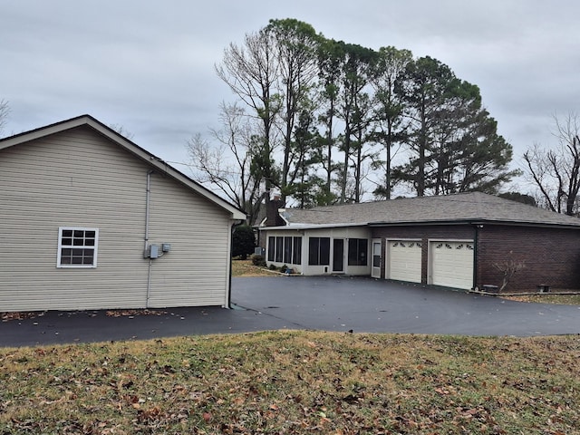 view of property exterior featuring a garage