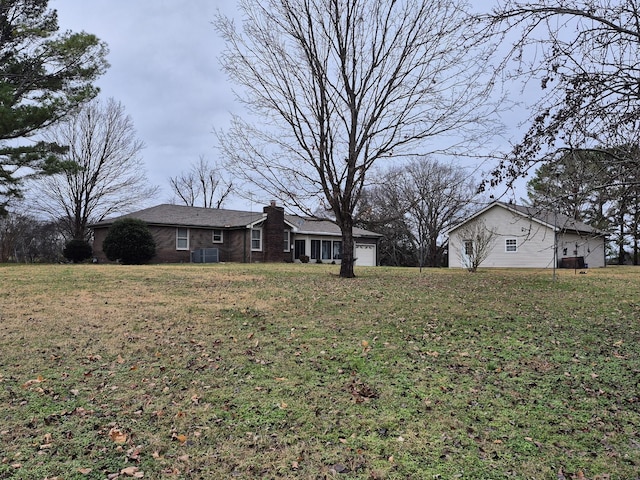 view of yard with a garage