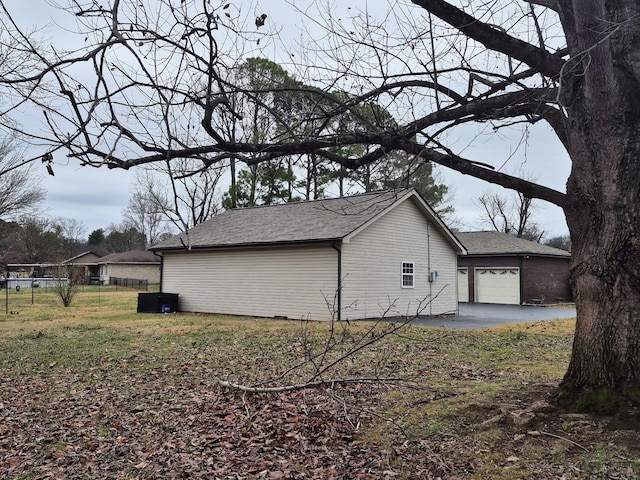 view of side of home featuring a garage